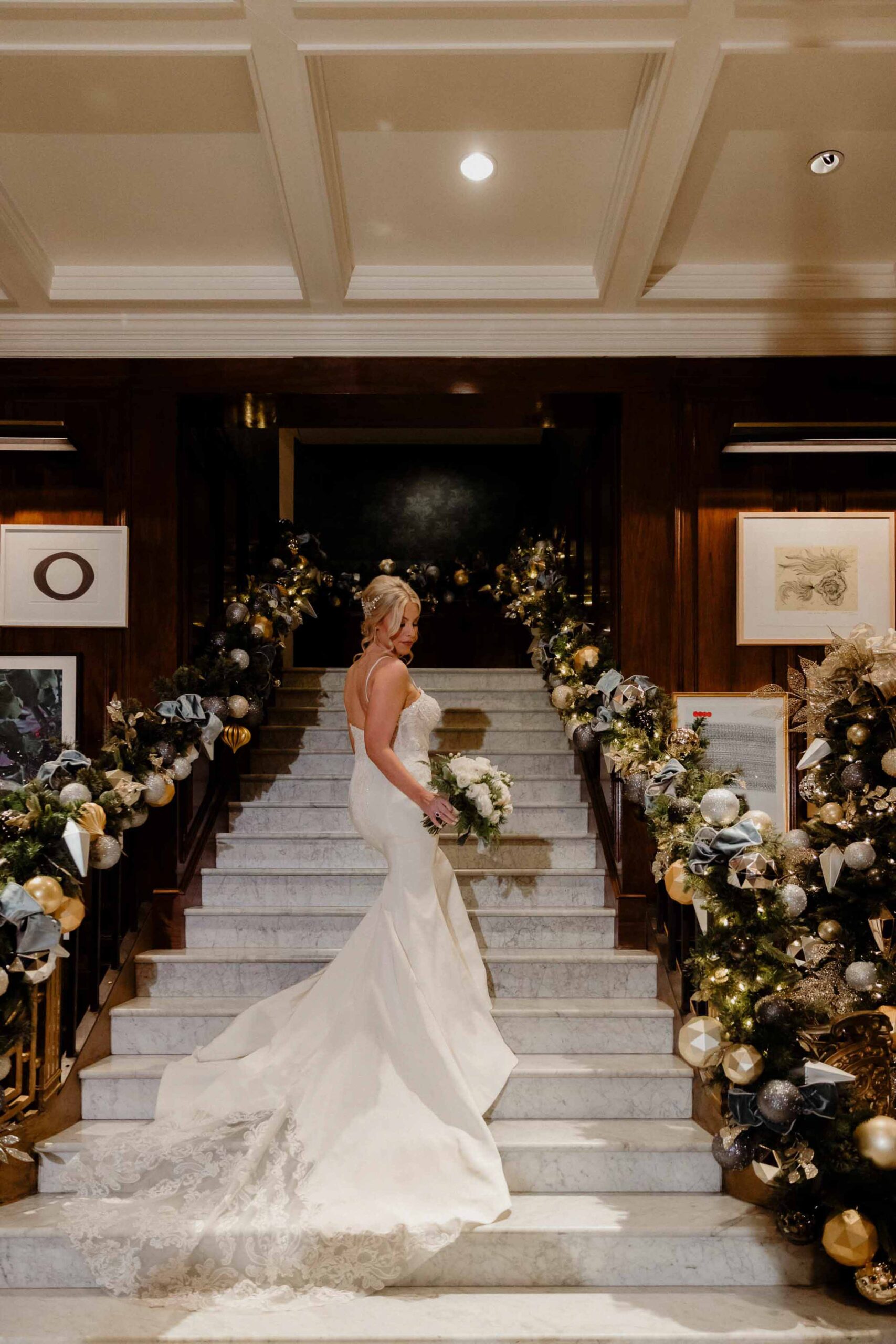 bride posing for her bridal portrait during her christmas themed wedding in the adolphus hotel in dallas