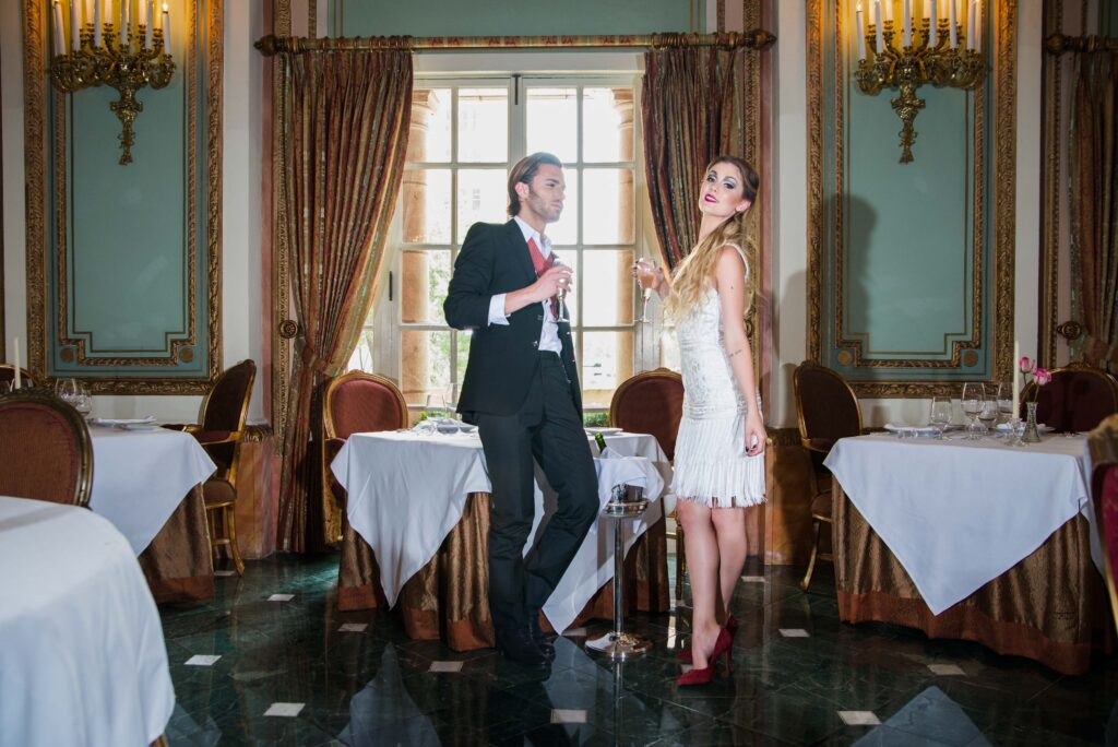 couples candid shot with a vintage style backdrop at at the adolphus hotel dallas