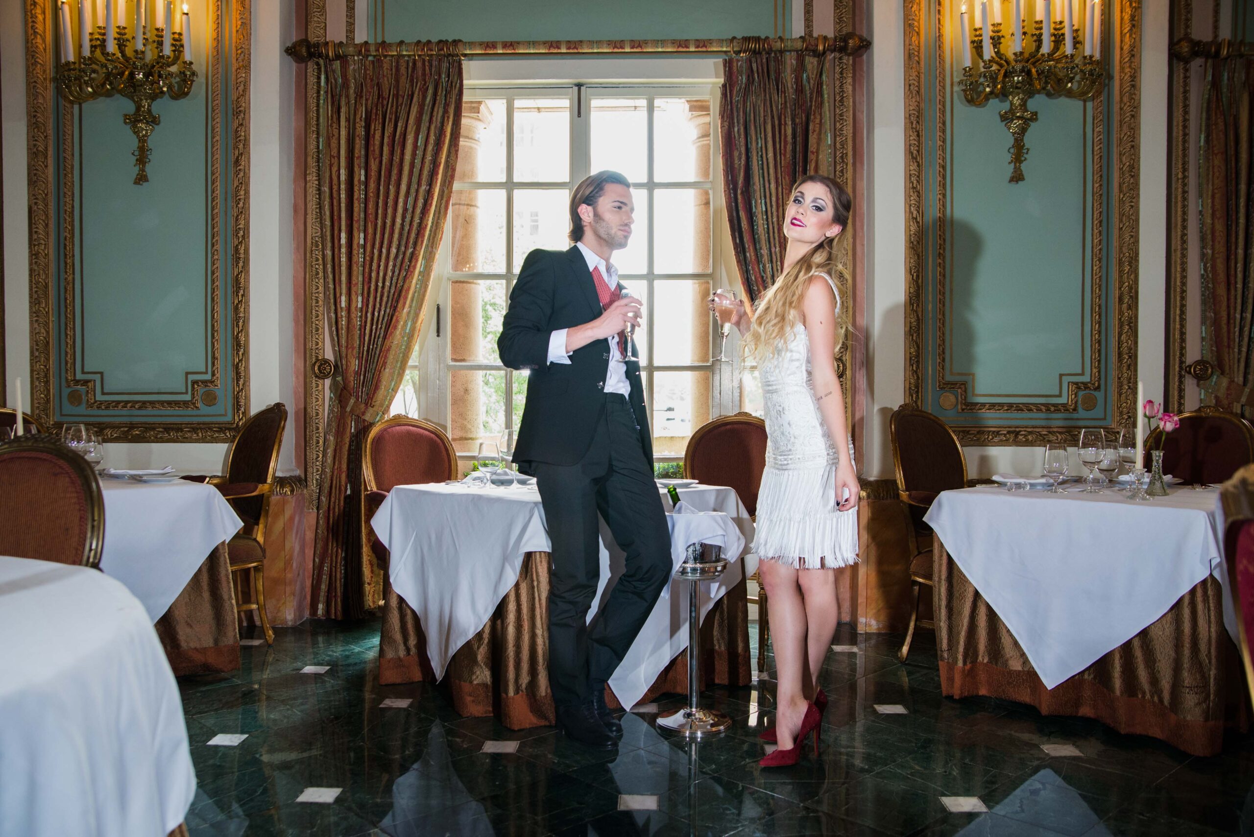 couples candid shot with a vintage style backdrop at at the adolphus hotel dallas