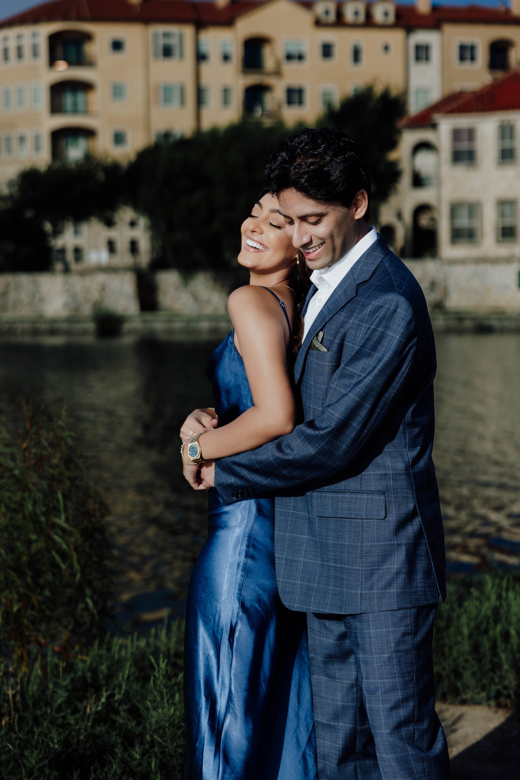 couple enjoying their time during an engagement session at the adriatica in mckinney texas