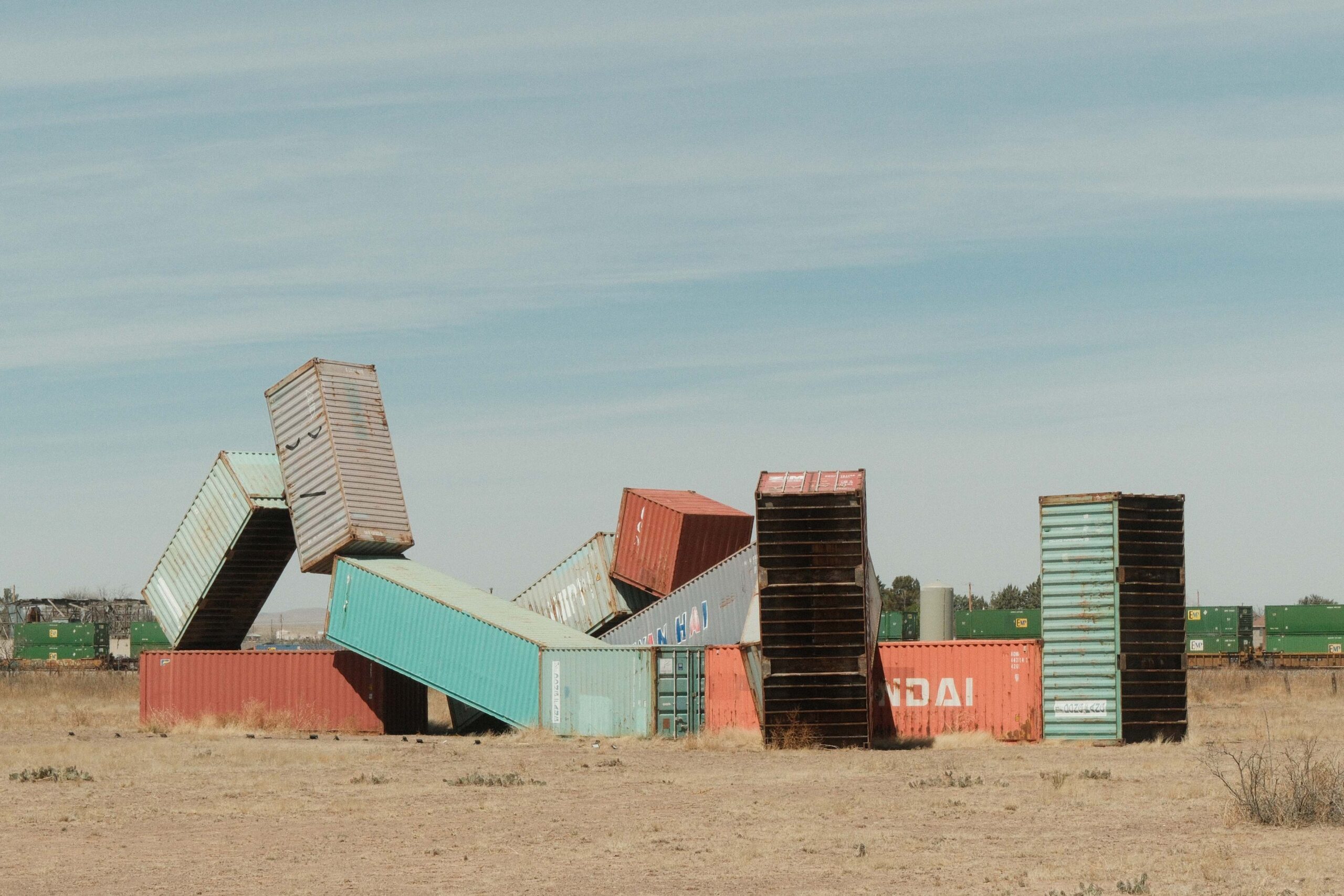 container art installation in marfa texas as of 2006, sleeping figure by Matt johnson arranged to resemble a reclining human figure against desert background
