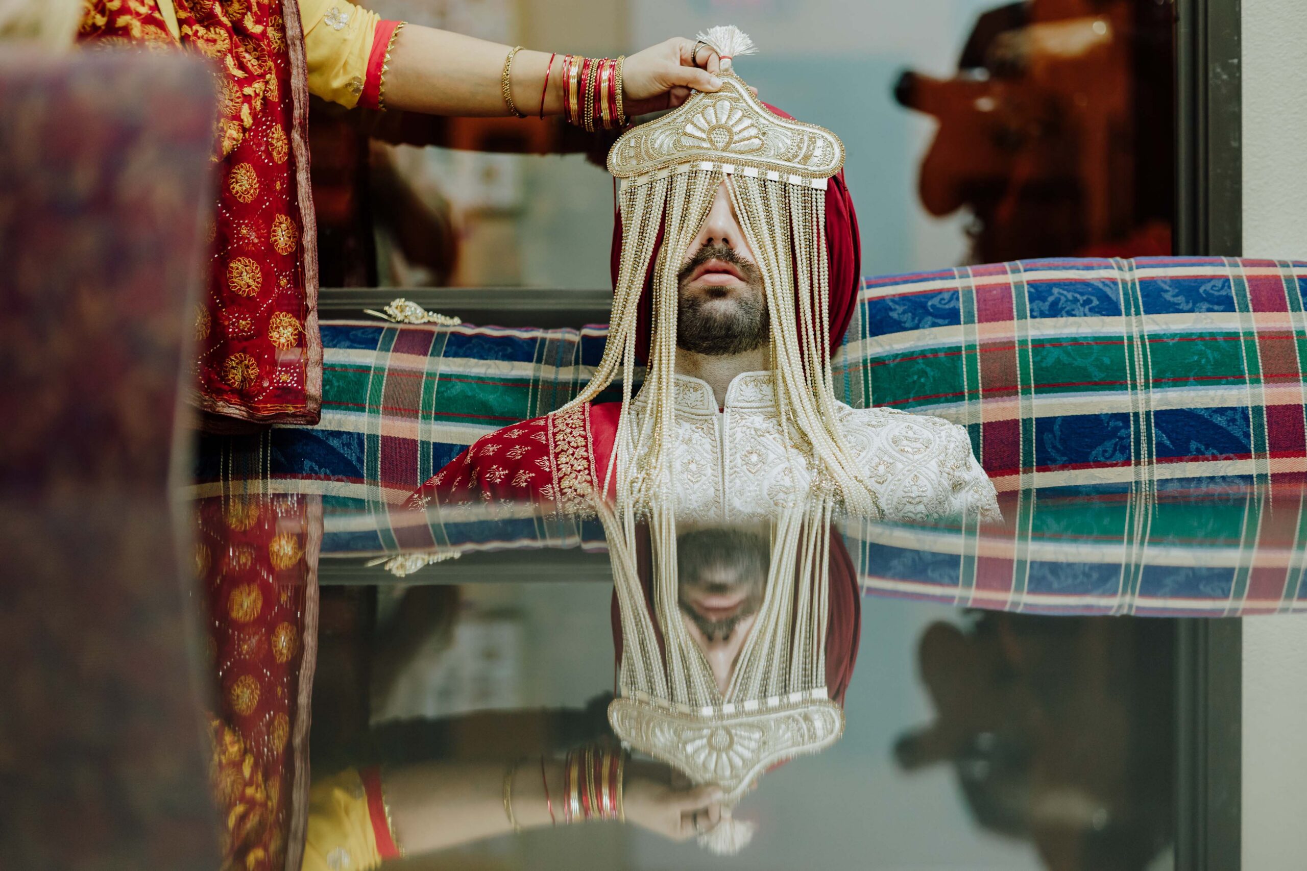 groom travis being prepared for his sikh ceremony at gurdwara sikh sangat euless texas