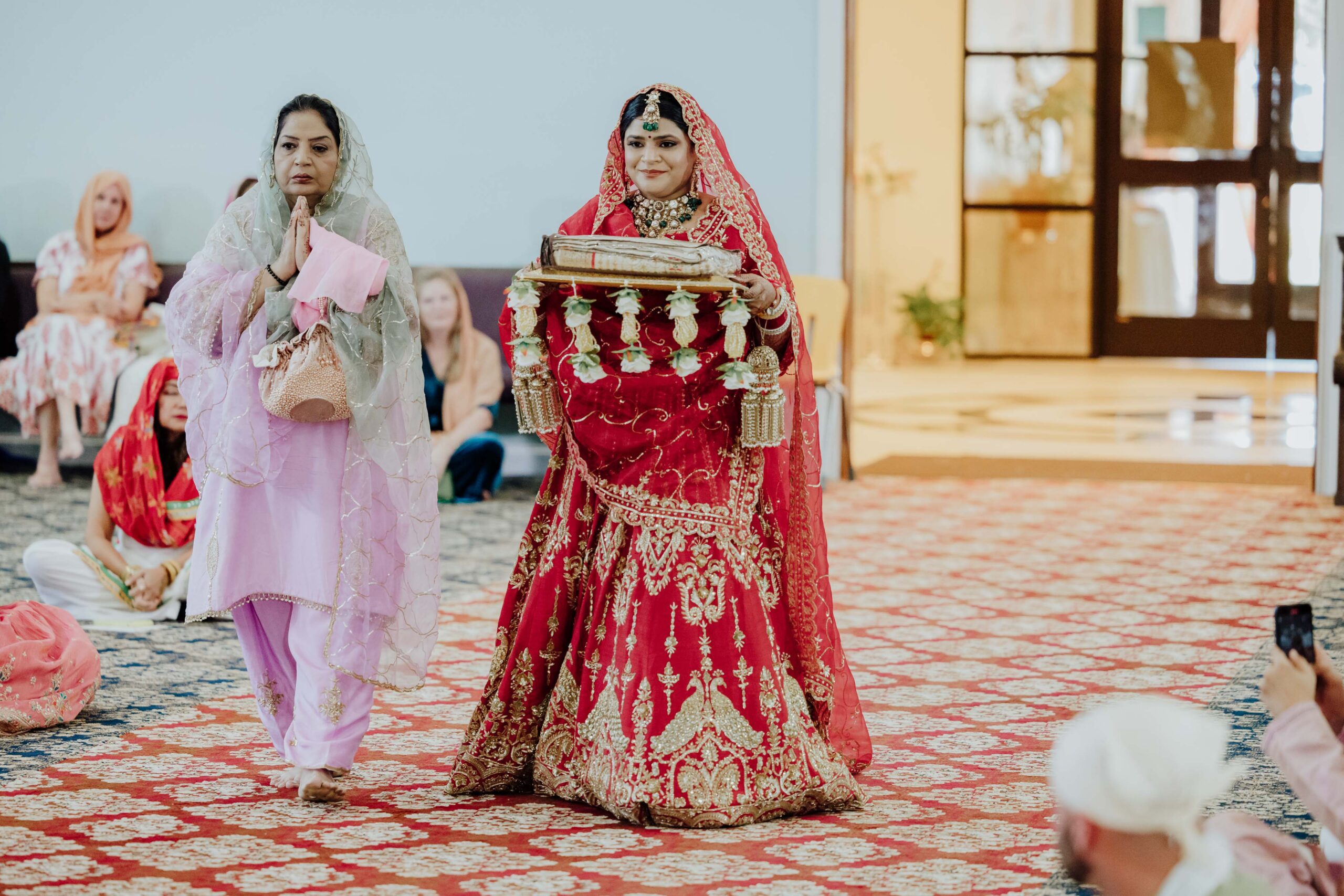 bride entrance for Sikh Anand Karaj wedding ceremony at Gurdwara Sikh Sangat in Euless Texas photographed by William Bichara