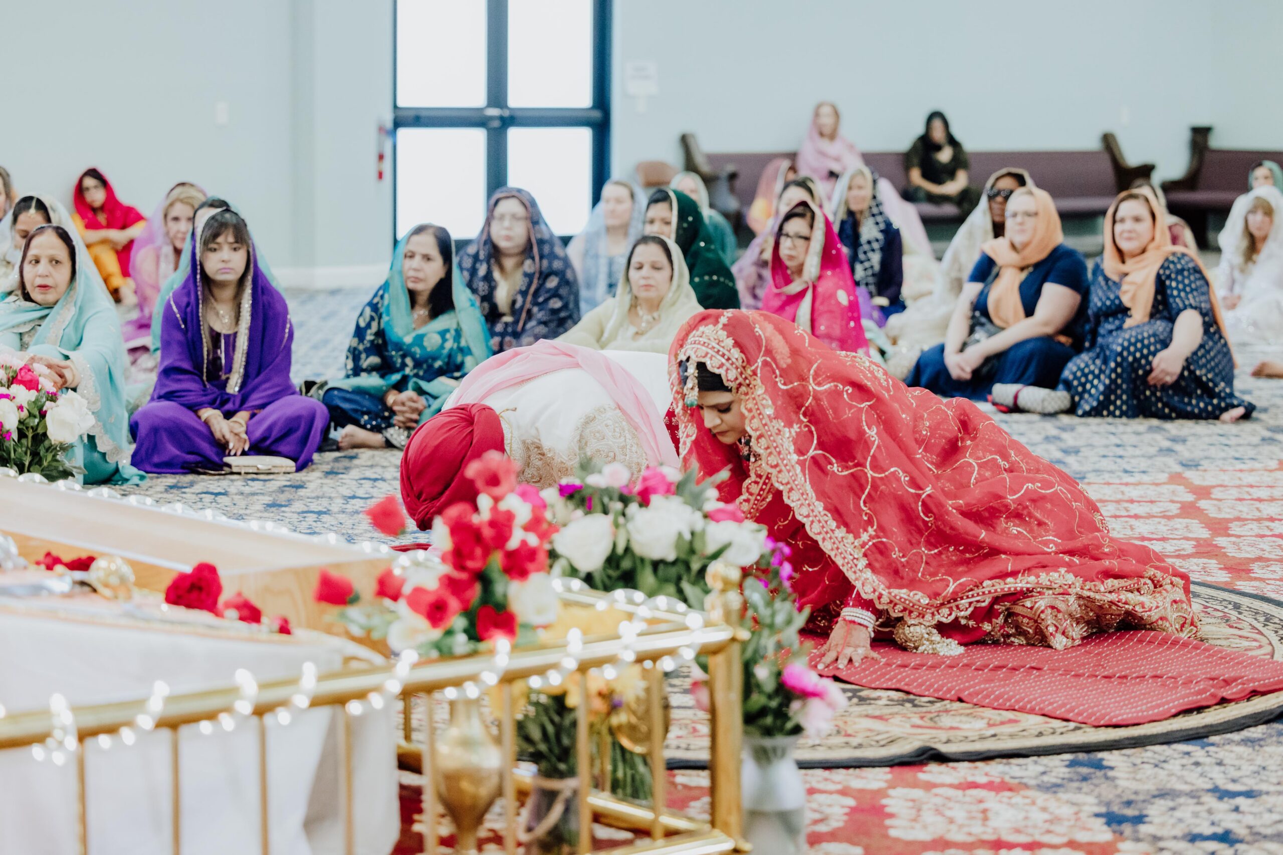 Surbhi and Travis performing the Lavan ceremony at Gurdwara Sikh Sangat in Euless Texas