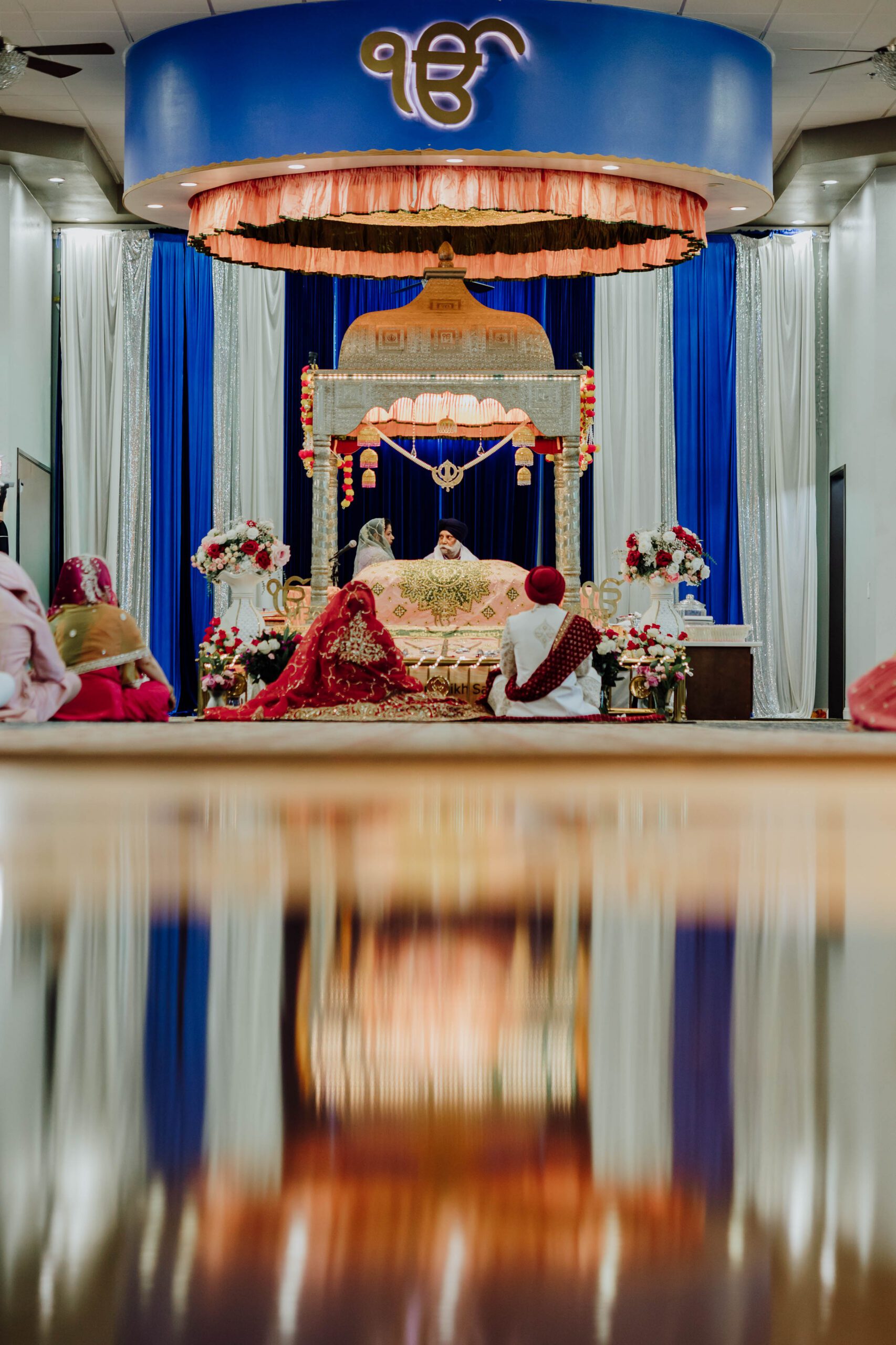 artistic and abstract shot of Sikh Anand Karaj wedding ceremony at Gurdwara Sikh Sangat in Euless Texas photographed by William Bichara