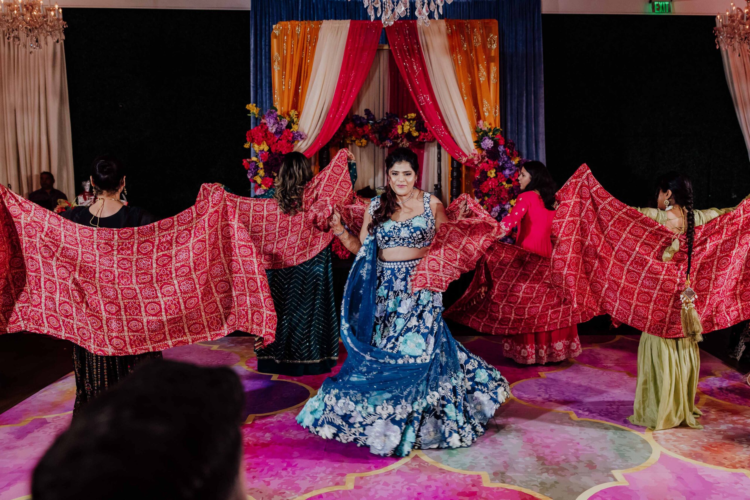 Family performance with bride at Sangeet night for multicultural Sikh wedding in Dallas Texas by William Bichara
