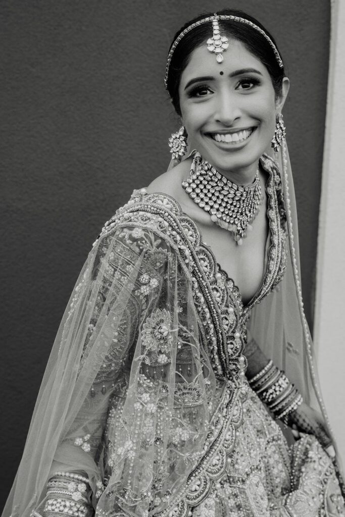 South Asian Hindu bride in traditional lehenga and kundan jewelry photographed by DFW wedding photographer William Bichara
